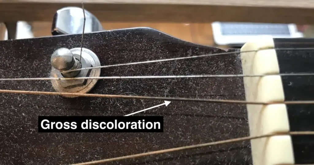gross discolouration of the guitar strings 