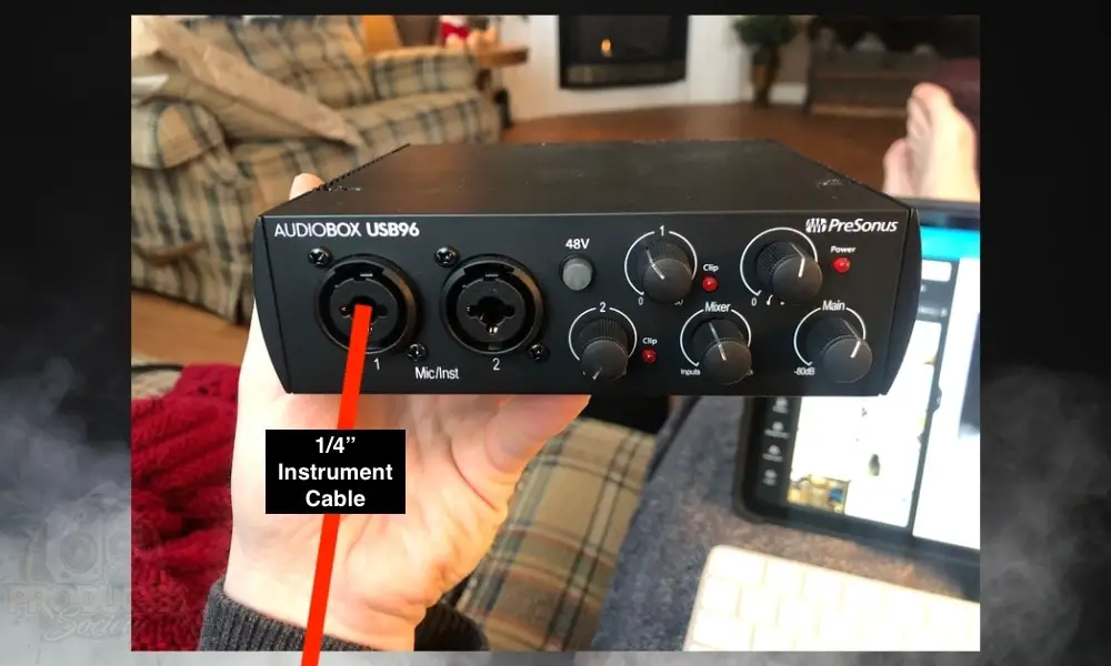 Connect a 1/4" Instrument Cable to the Audio Box 